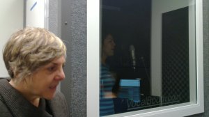 Alison beside Maryam in the sound booth