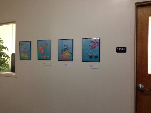 the illustrations are in front of study room at the UT Arlington library